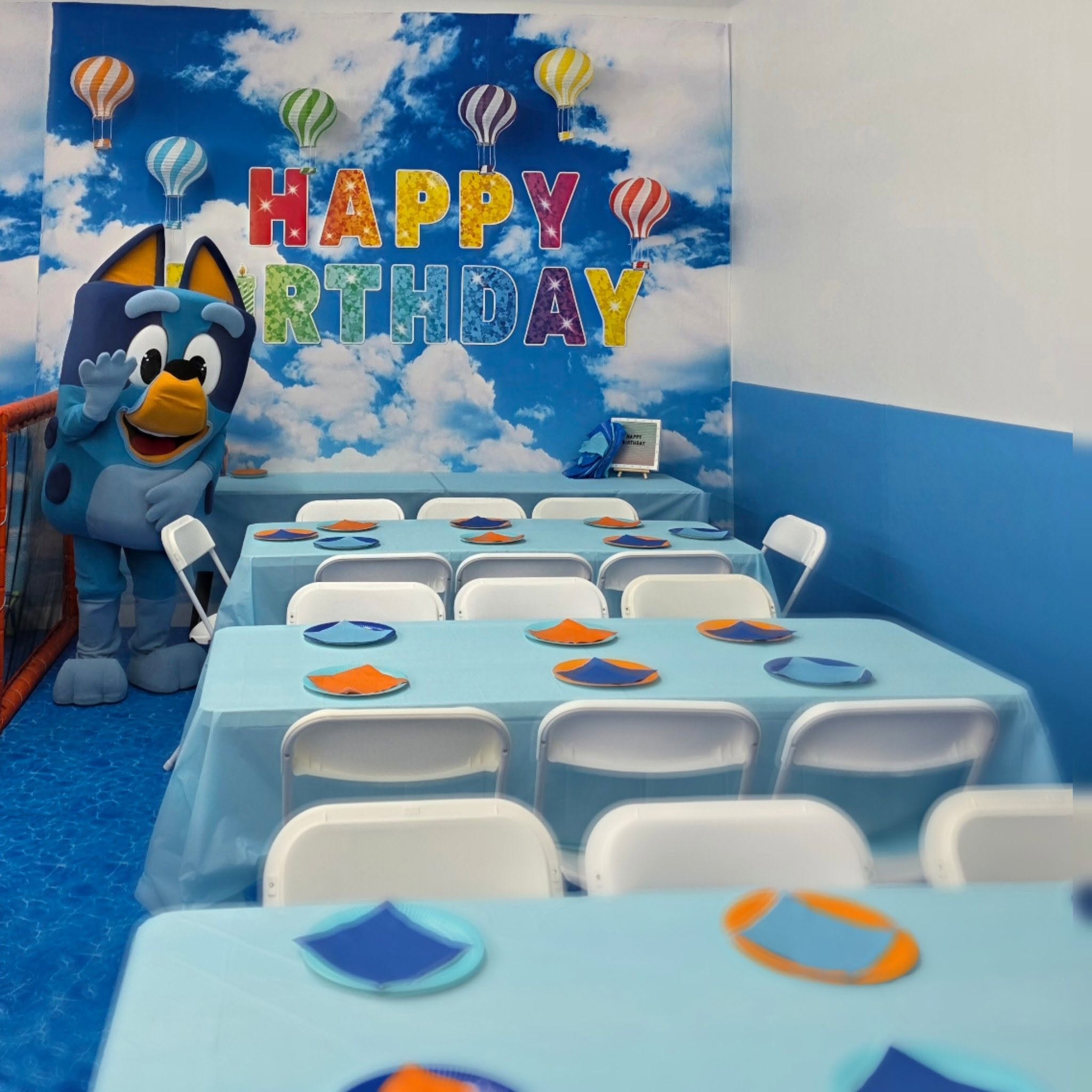 Bluey character greeting guests at a KidVenture World birthday party
